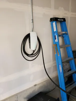 Wall-mounted EV charger installation in a garage