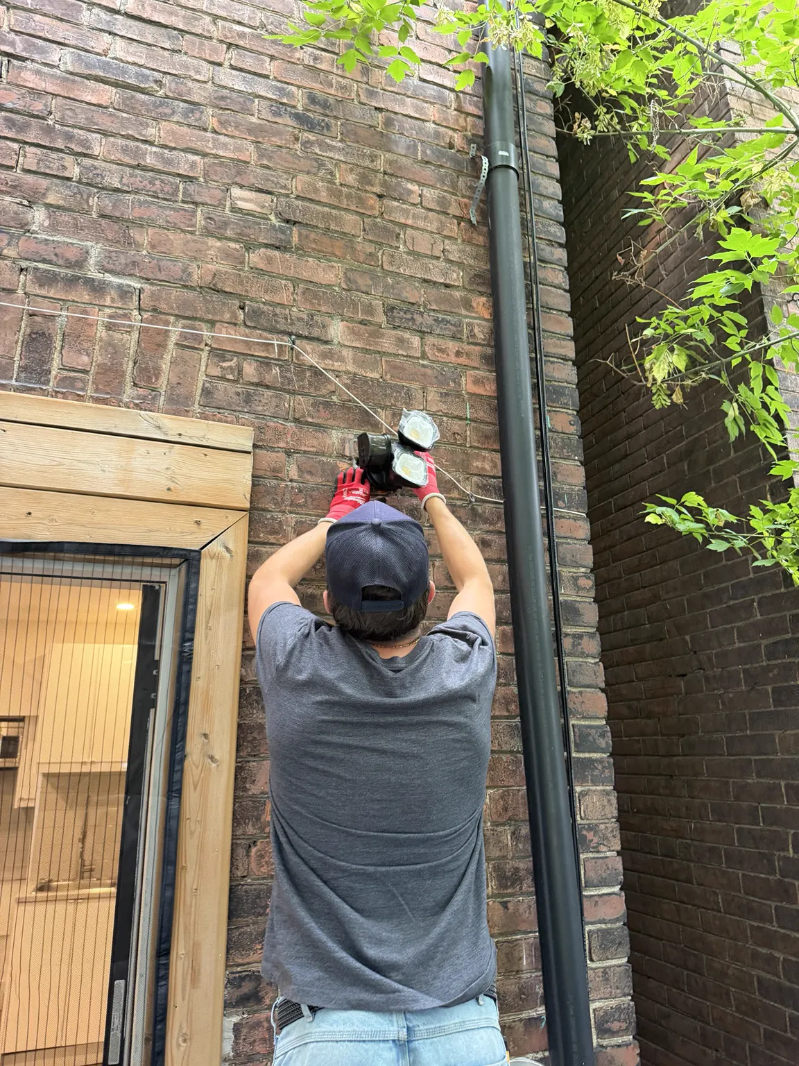 Exterior electrical installation on a brick wall